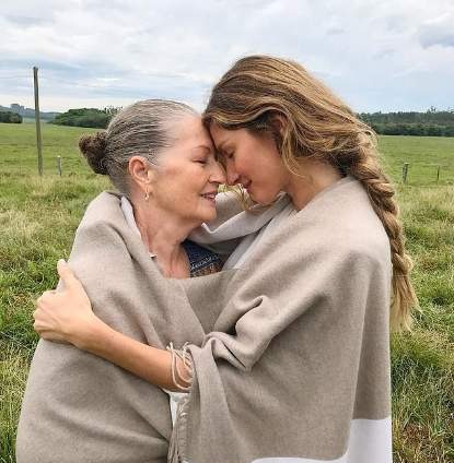Gisele sharing a hug with her mother